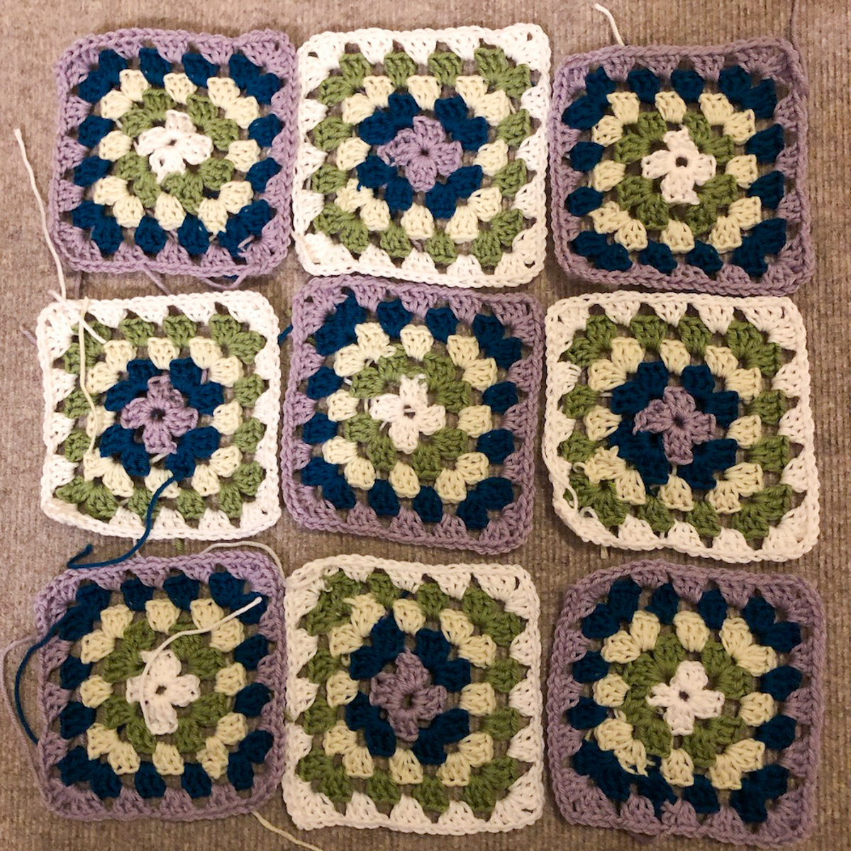 9 granny squares laid out in noughts and crosses