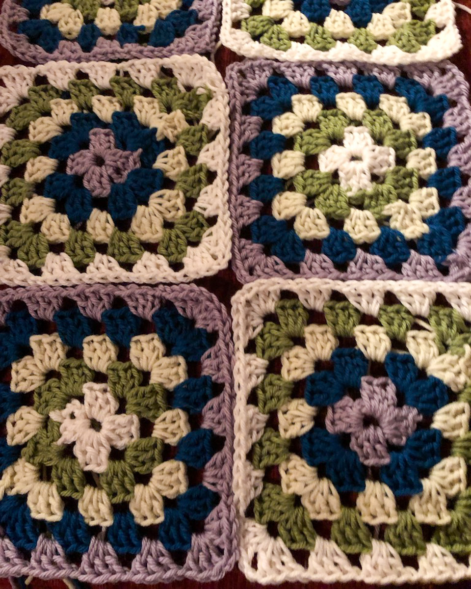 6 granny squares laid out in contrasting colours
